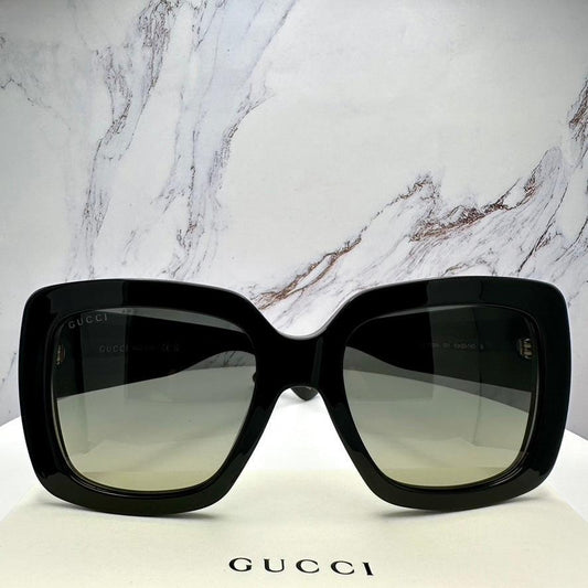 Gucci GG0141SN 001 black oversized sunglasses front view.