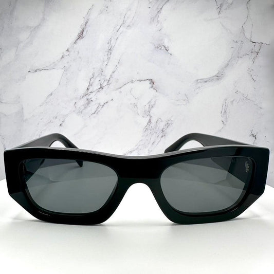 PRADA 0PRA01S 16K08Z black acetate sunglasses front view with grey lens.