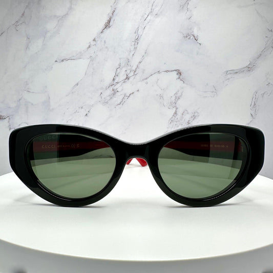 GUCCI GG1862S 001 black cat eye striped web arm gold metal logo women's sunglasses front frame.