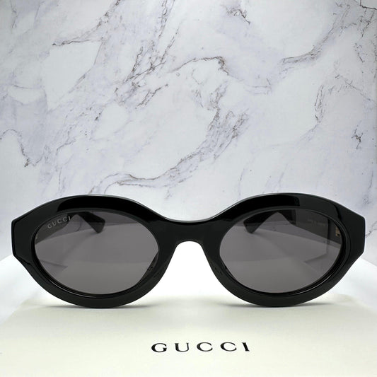 Gucci GG1579S 001 black oval front view