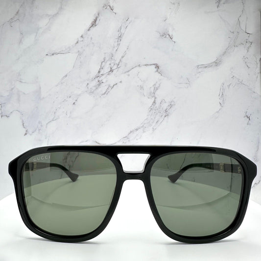 Gucci GG1494S 001 black aviator mens sunglasses with gold letter logo front frame