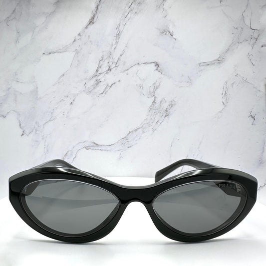 Prada 0PR26ZS 16K08Z black cat eye oval symbole sunglasses with grey lens front view