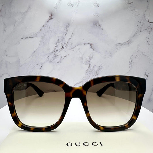 Gucci GG1338S 003 brown tortoise oversized square sunglasses with gold lens.