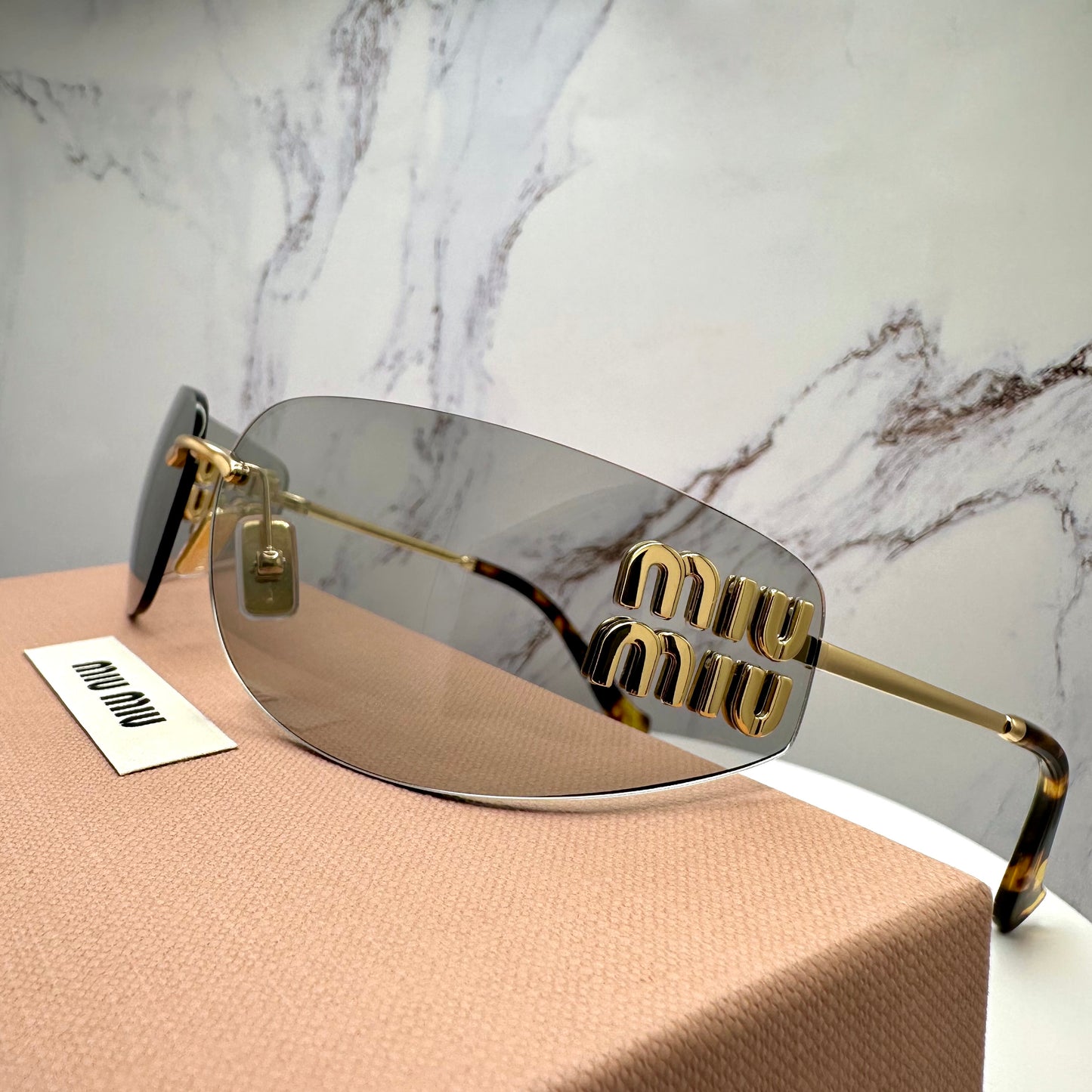 MIU MIU MUA51S 5AK50K Sunglasses Gold Rimless Wrap Square