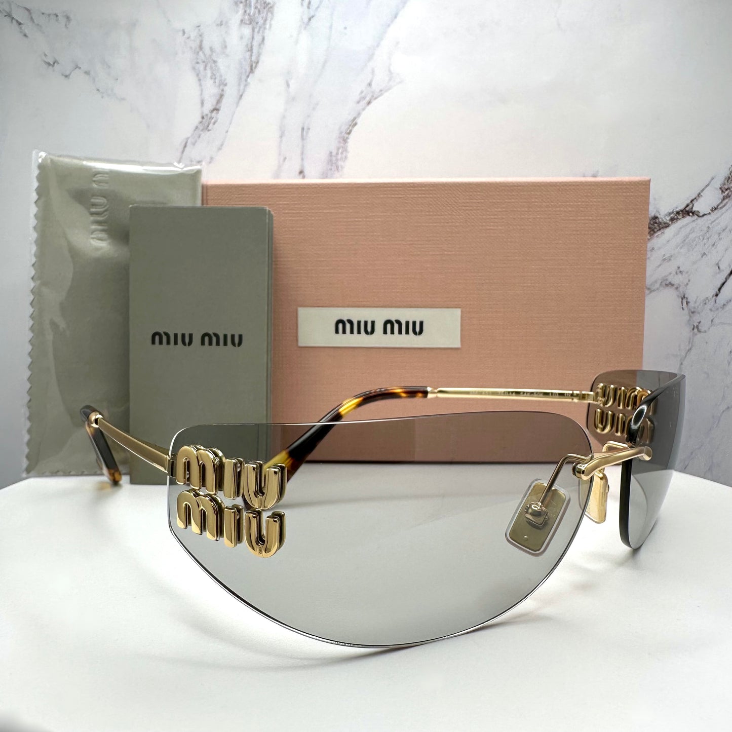 MIU MIU MUA51S 5AK50K Sunglasses Gold Rimless Wrap Square