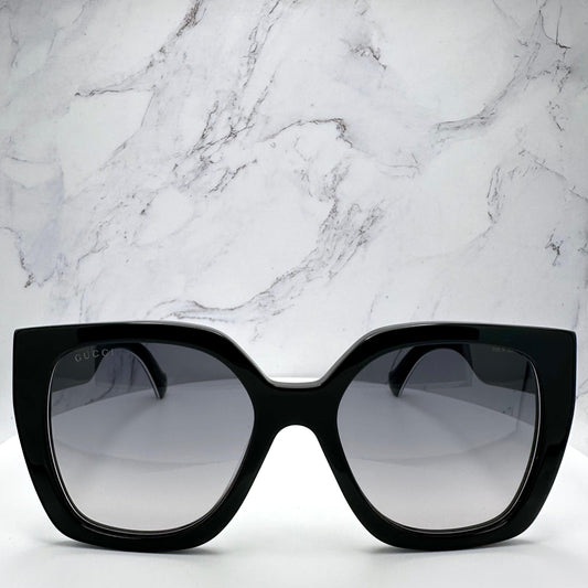 Gucci GG1300S 004 black oversized square frames web arms gold logo front view