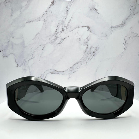 VERSACE VE4466U GB1/87 black oval women's sunglasses with medusa logo.