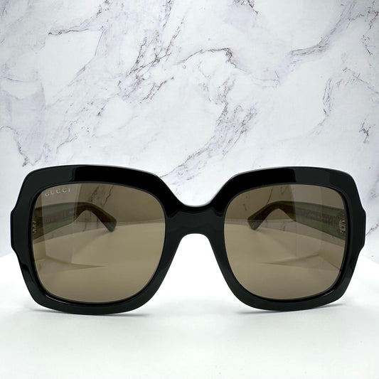 Gucci GG0036SN 002 black sunglasses with striped web arms front view