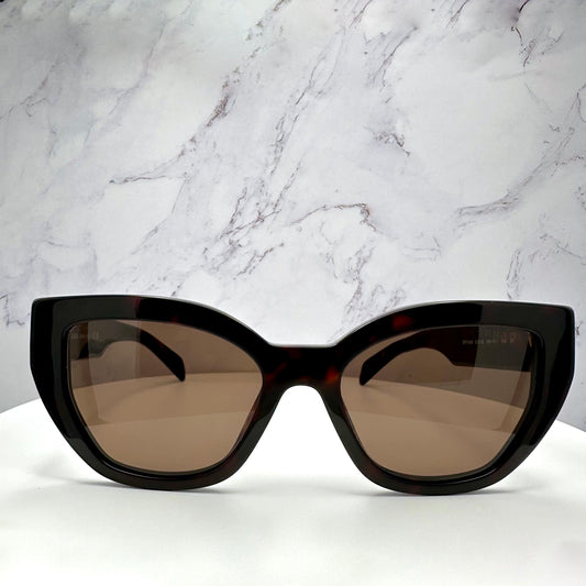 PRADA PR A09S 16N5Y1 brown tortoise cat eye sunglasses with gold logo front view.