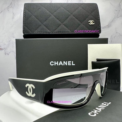 Chanel CH6057 1656/S6 black shield sunglasses with white interlocking CC logo side view.