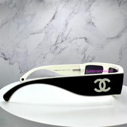 Chanel CH6057 1656/S6 black shield sunglasses with CC logo side view.