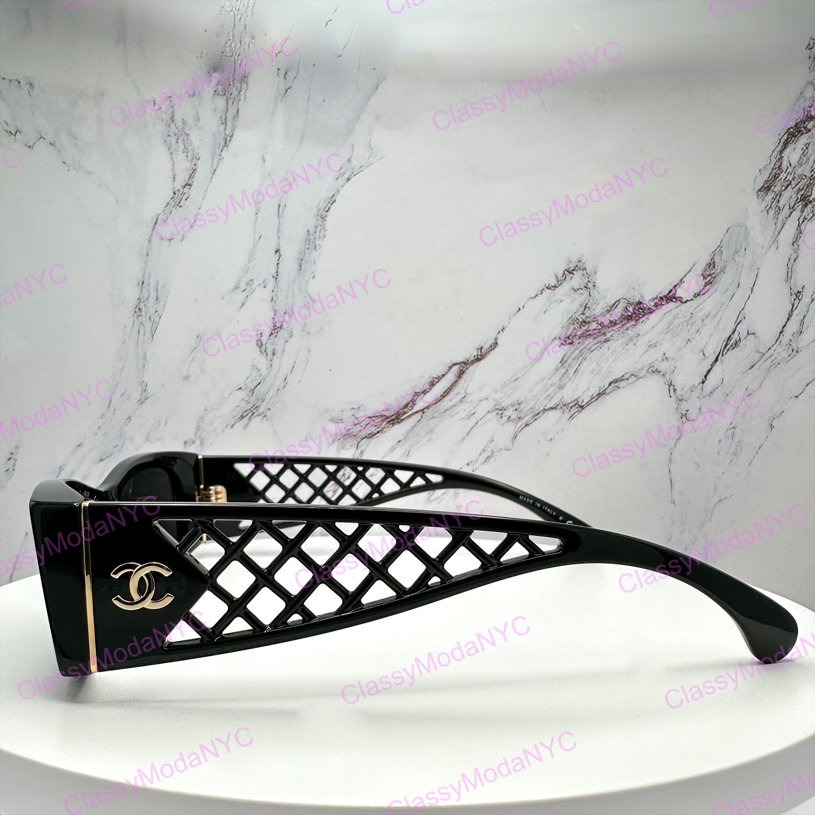 5566 1850/S4 Black Chanel sunglasses with lattice tweed design on a marble background