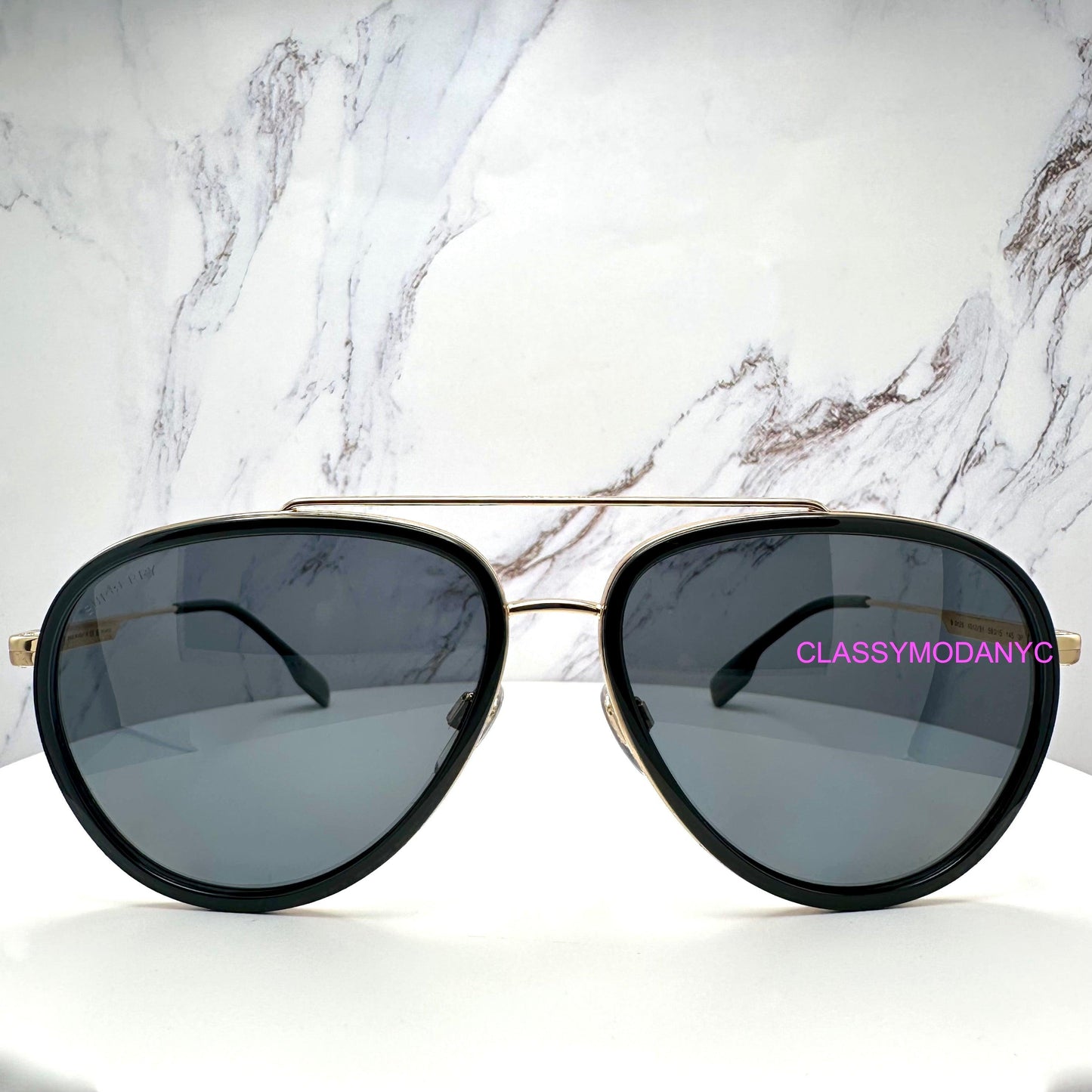 Burberry 0BE3125 101781 gold metal check arm black aviator sunglasses front view