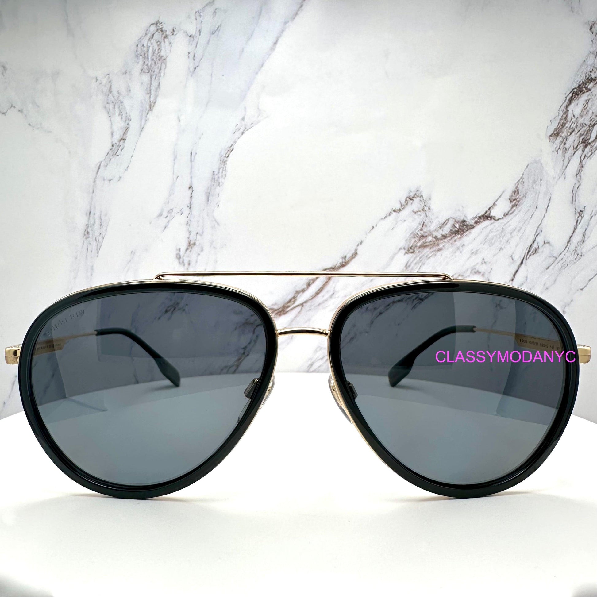 Burberry 0BE3125 101781 gold metal check arm black aviator sunglasses front view