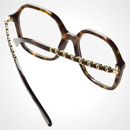 CHANEL CH3489Q C714 brown tortoise oversized frame with gold chain arm eyeglasses.