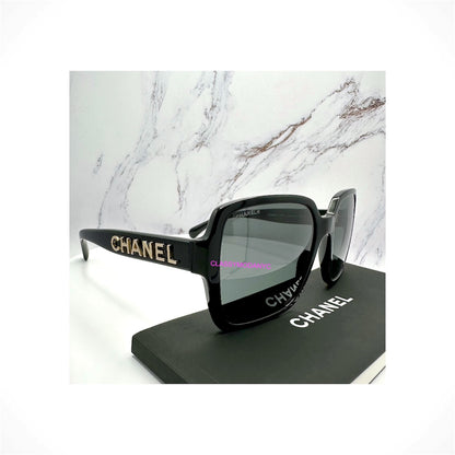 CHANEL 5408 C622/S4 black oversized square acetate sunglasses with 3D gold CHANEL lettering on the temple arms