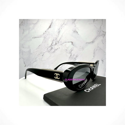 CHANEL 5515 C622/48 women's black oval cat eye polarized sunglasses with grey lenses and gold CC chain detailing