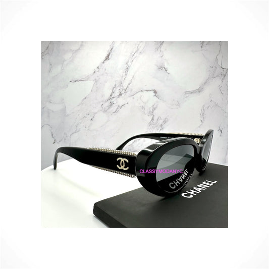 CHANEL 5515 C622/48 women's black oval cat eye polarized sunglasses with grey lenses and gold CC chain detailing