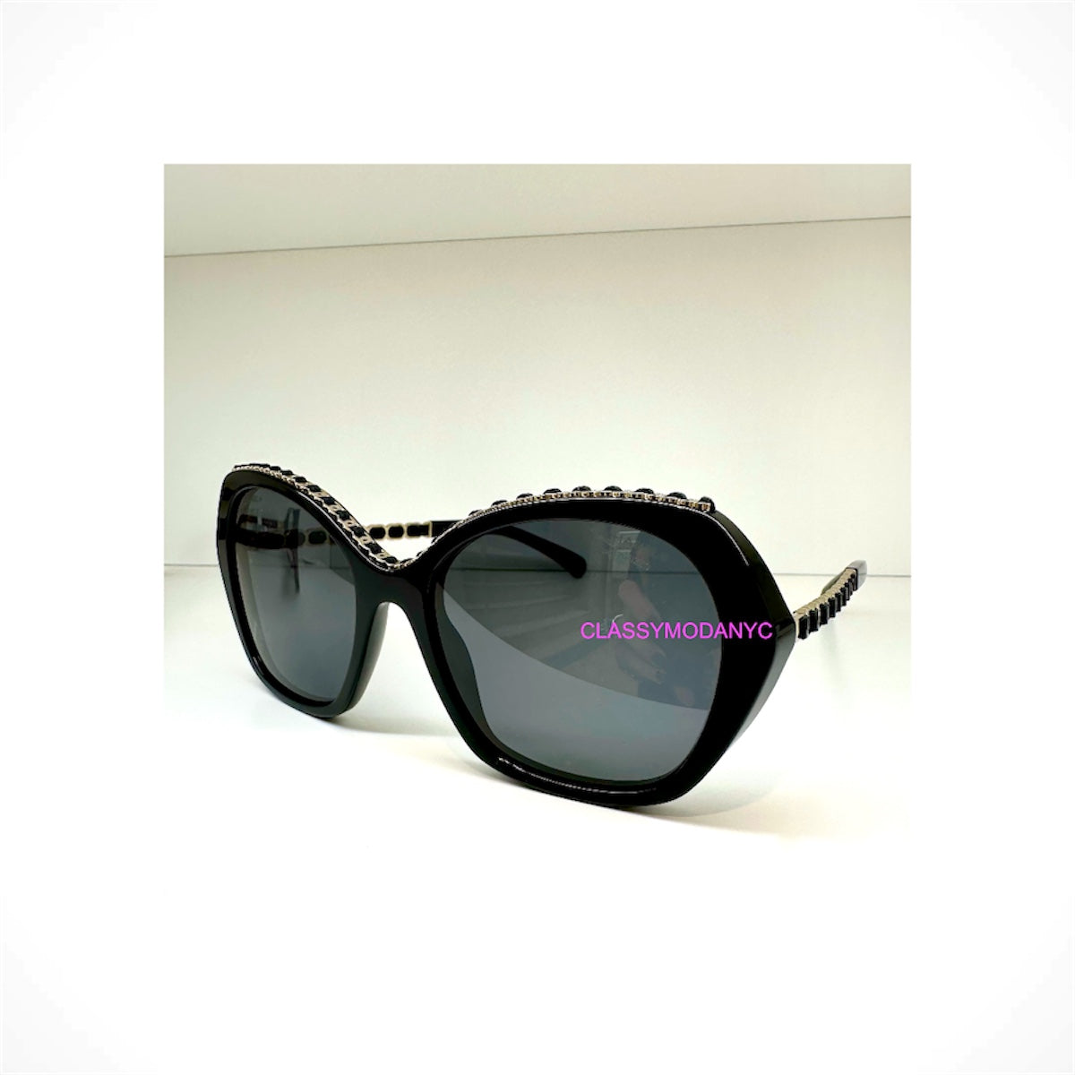 CHANEL 5547Q C622/T8 women's black butterfly sunglasses with gray polarized gradient lenses and gold CC chain detailing