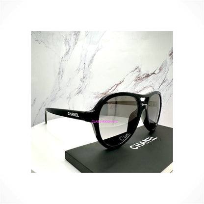 CHANEL 5552U C501/M3 women's black pilot aviator sunglasses with gray polarized gradient lenses and CHANEL letter logos