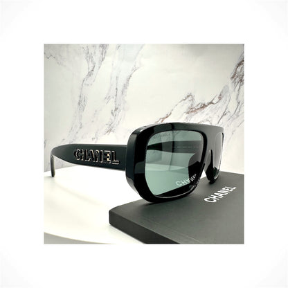 CHANEL 5556U C622/S4 unisex black shield sunglasses with gray lenses and CHANEL CC logo detailing
