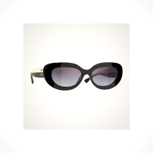 CHANEL 5562B C501/S6 women's black oversized oval sunglasses with gray gradient lenses and crystal CC logo