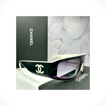 CHANEL 6057 1656/S6 unisex black and white shield wrap sunglasses with gradient gray lenses and interlocking CC logos