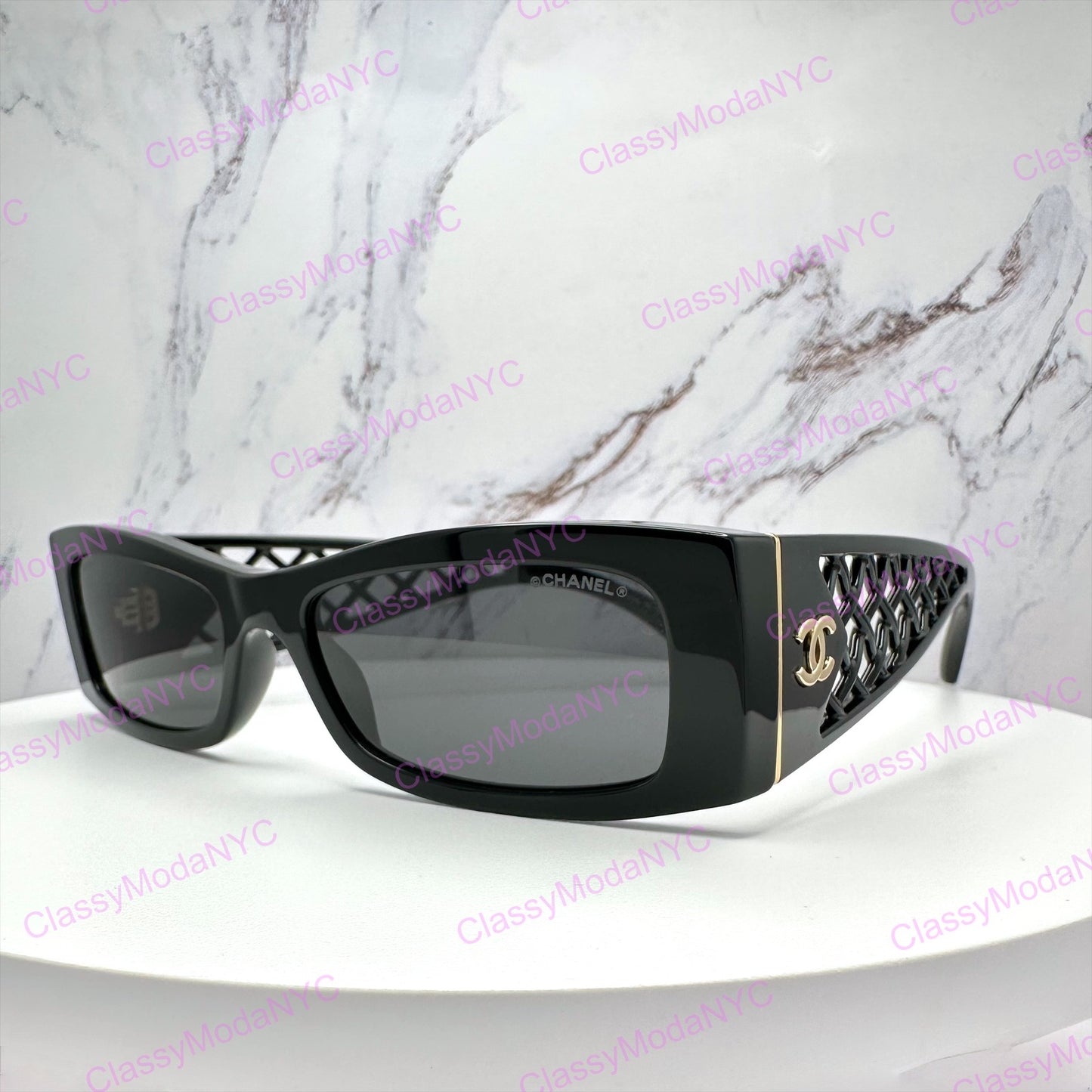 Chanel Black sunglasses 5566 on a white surface with a marble background
