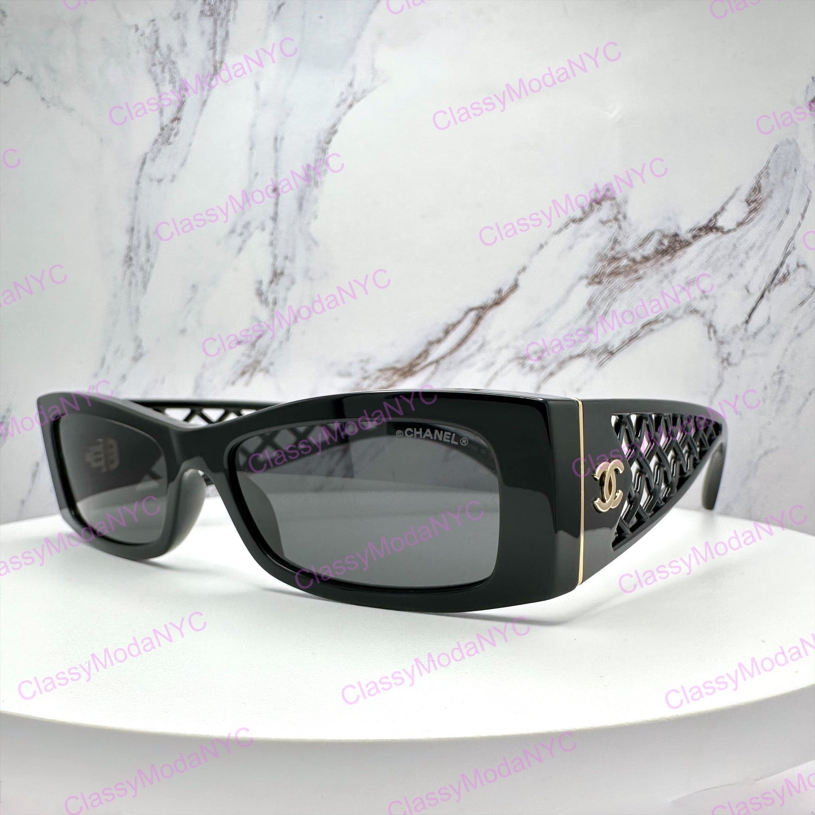 Chanel Black sunglasses 5566 on a white surface with a marble background