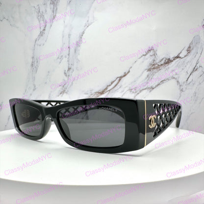 Chanel Black sunglasses 5566 on a white surface with a marble background