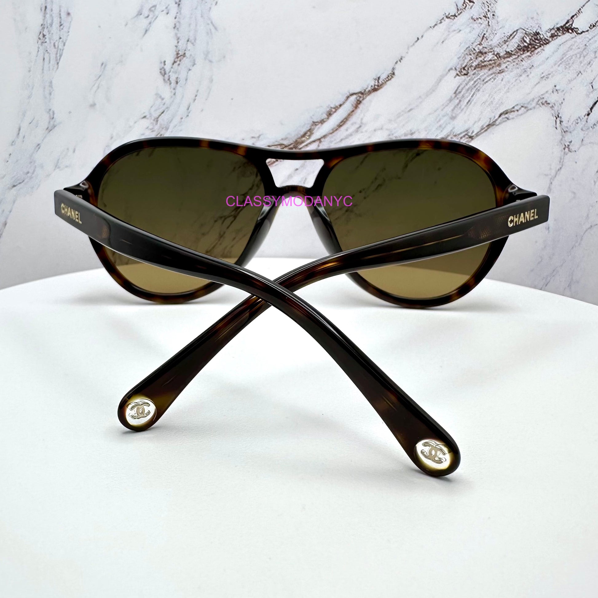 Chanel brown tortoise gold logo 