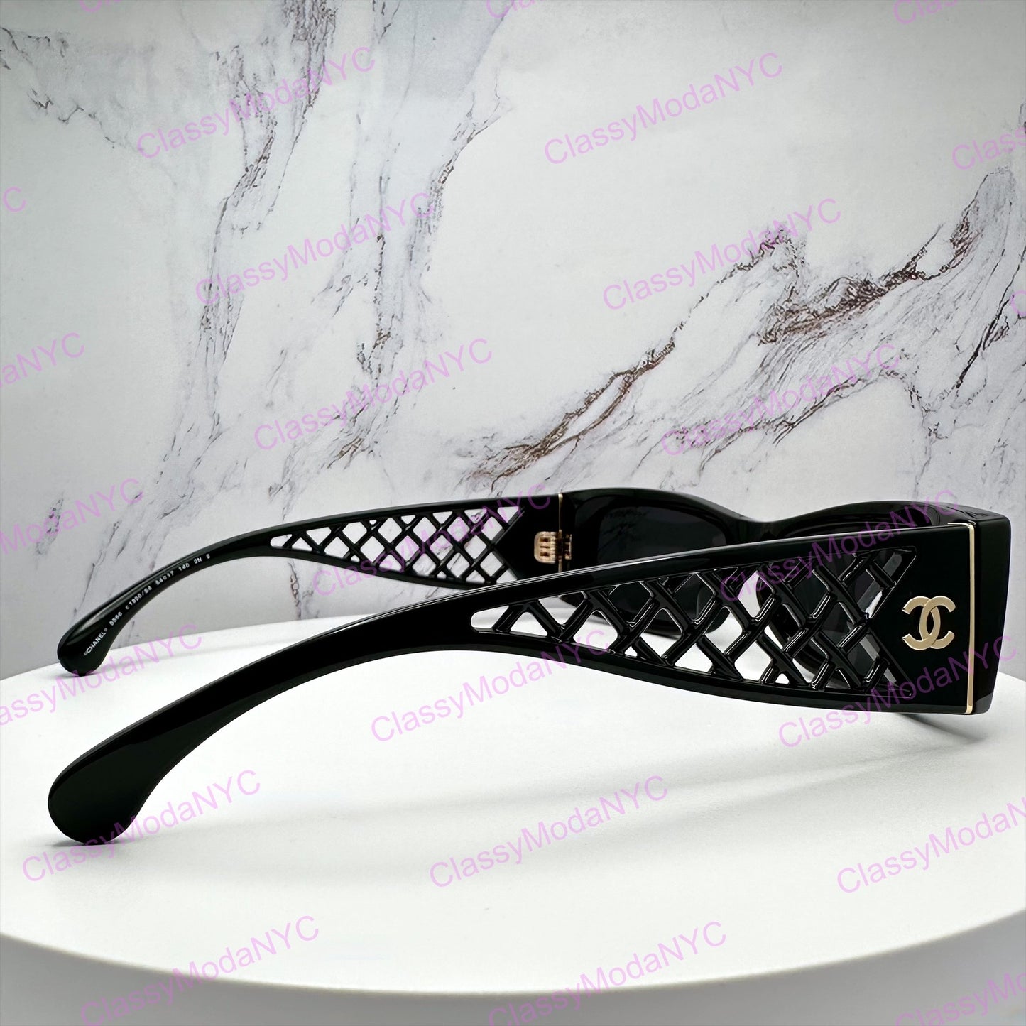 5566 1850/S4 Black Chanel sunglasses with lattice tweed design on a marble background 5