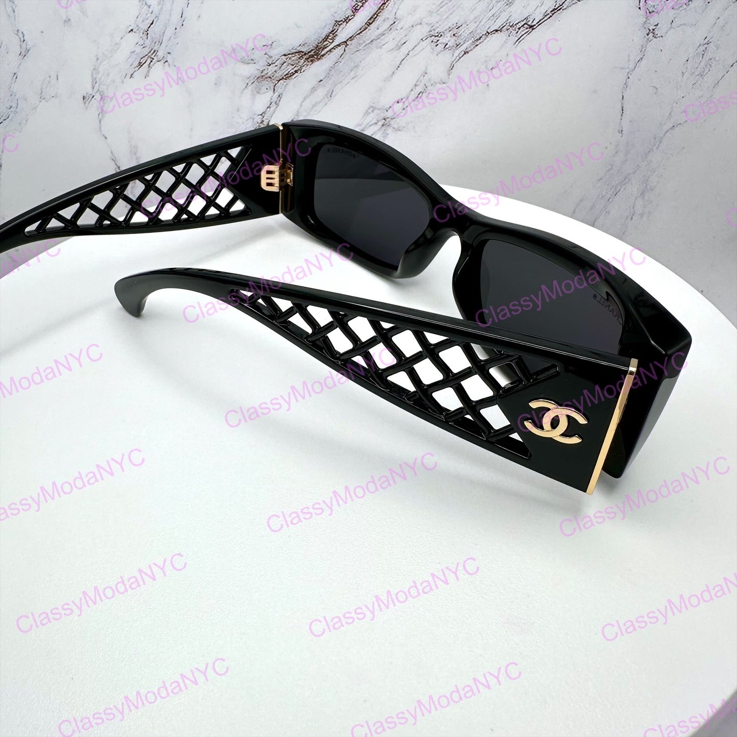 Chanel sunglasses Black square glasses 5566 back view on a white surface with a marble background