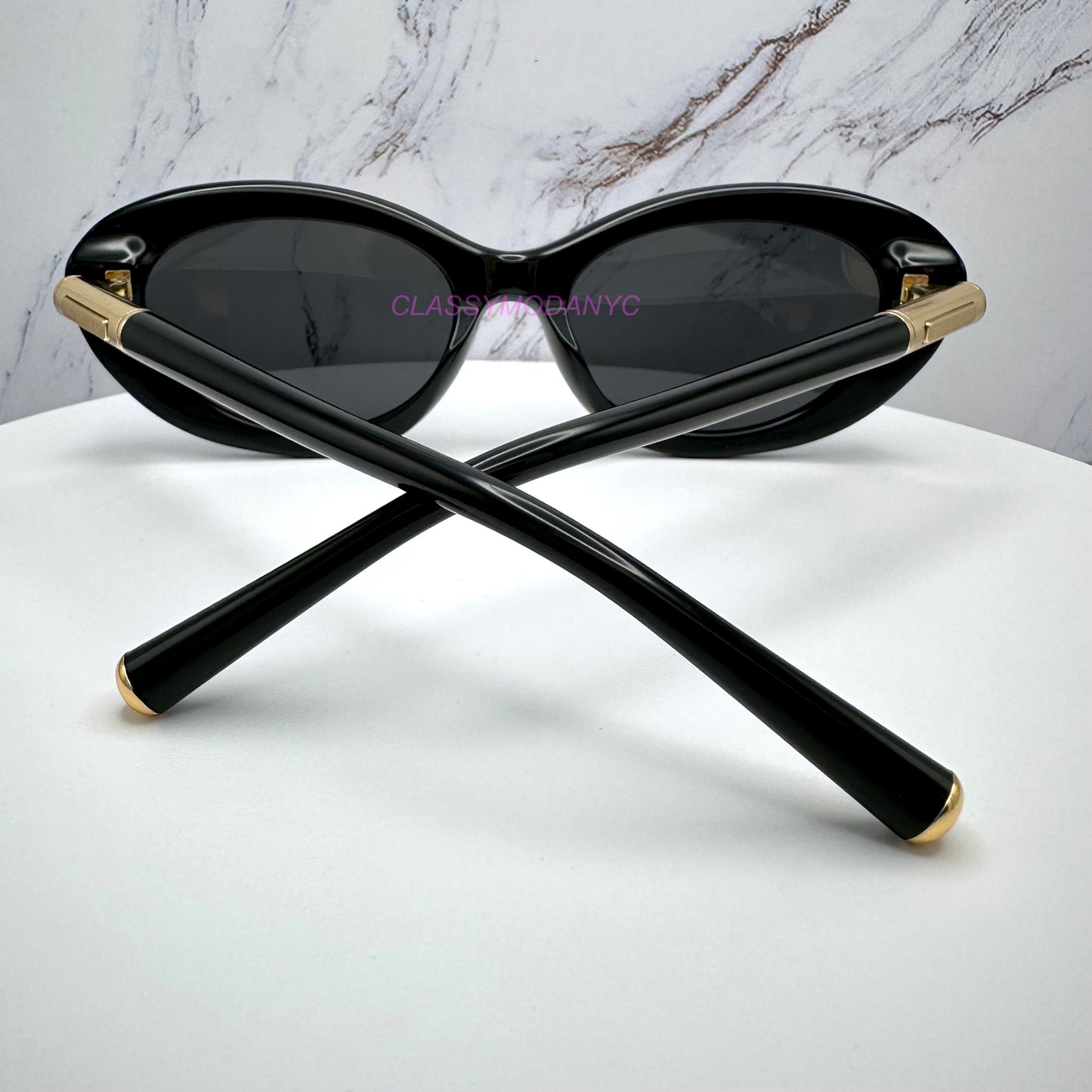 Dolce & Gabbana DG4519 501/87 sunglasses with black frame and gold accents back view 