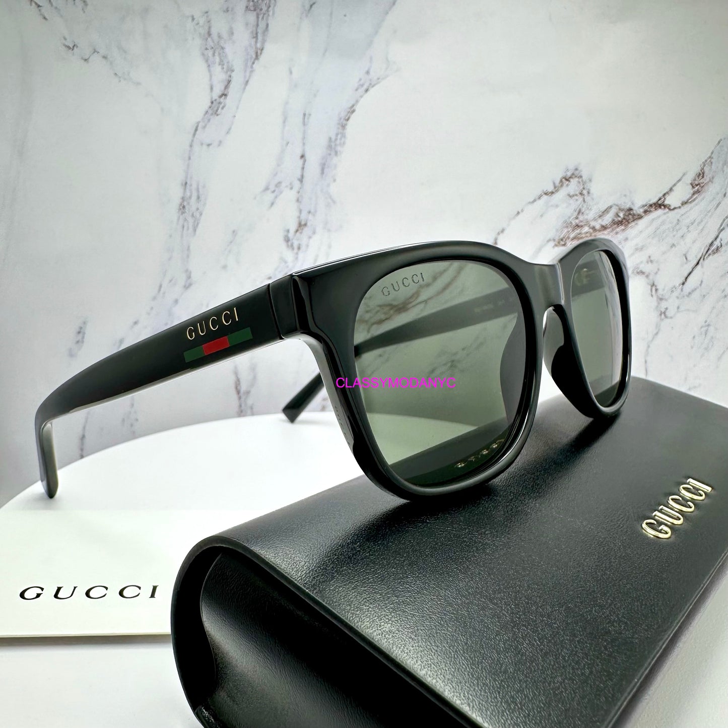 GG1985S 001 Gucci Sunglasses black side view with red green web arm with black case 