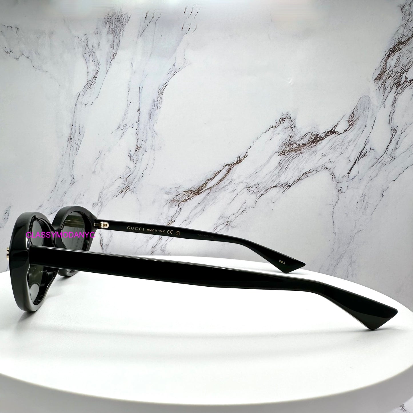 GG2110S 001 black sunglasses side view gold metal logo women's cat eye 