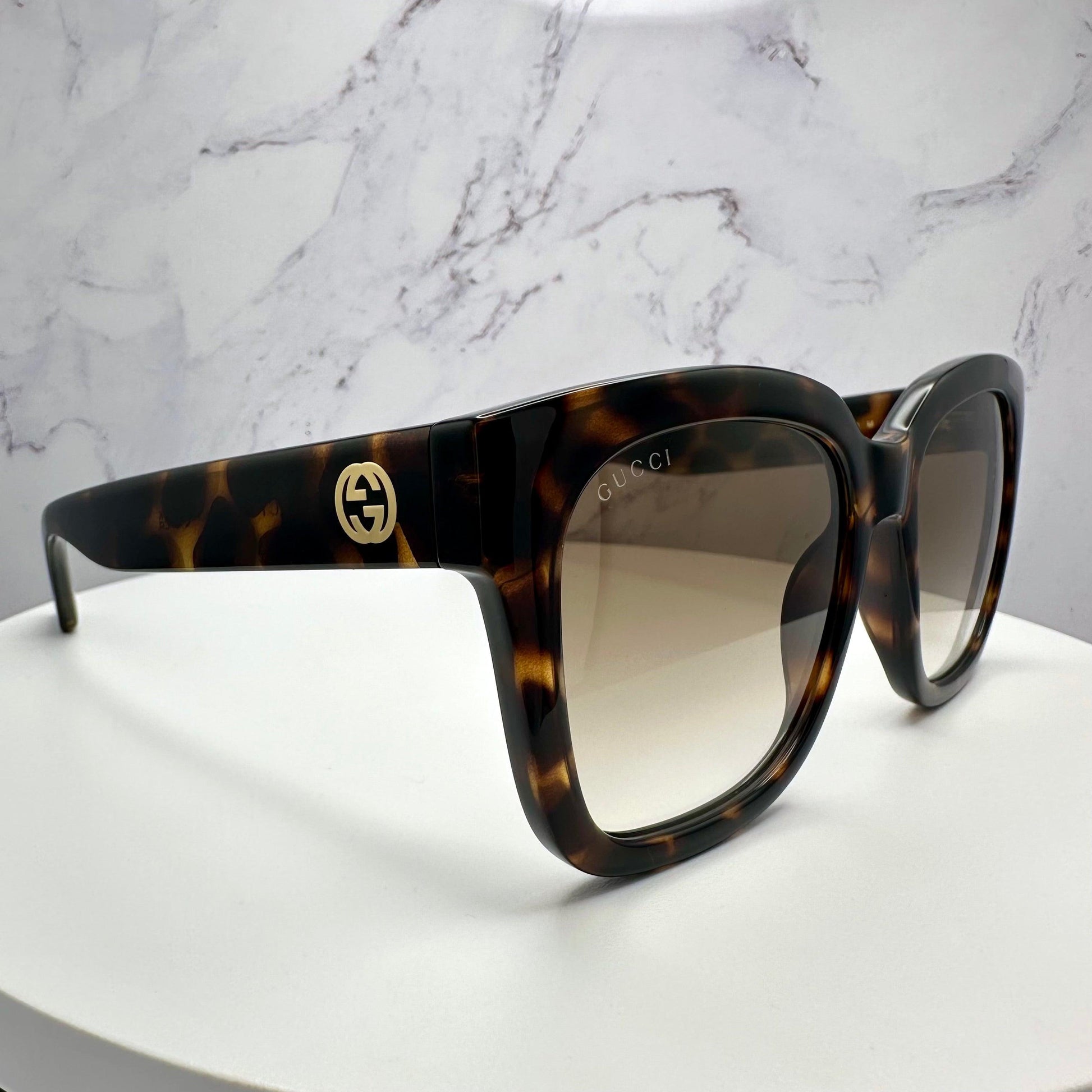 Gucci GG1338S 003 brown tortoise square sunglasses with gold lens.