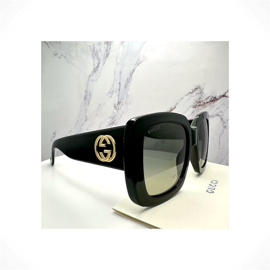 Gucci GG0141SN 001 women's black oversized square sunglasses with gold GG logo