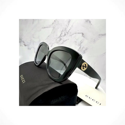 Gucci GG0327S 001 women's black cat eye sunglasses with gold GG logo