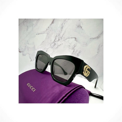 Gucci GG1422S 001 women's black cat eye acetate sunglasses with gold GG logo

