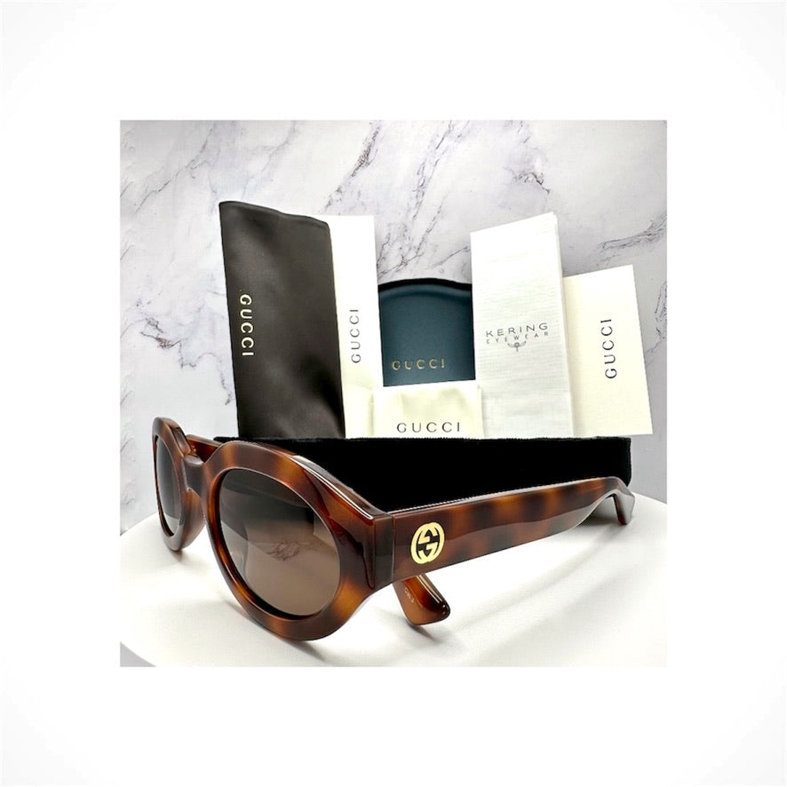 Gucci GG1579S 002 women's brown tortoise slim oval sunglasses