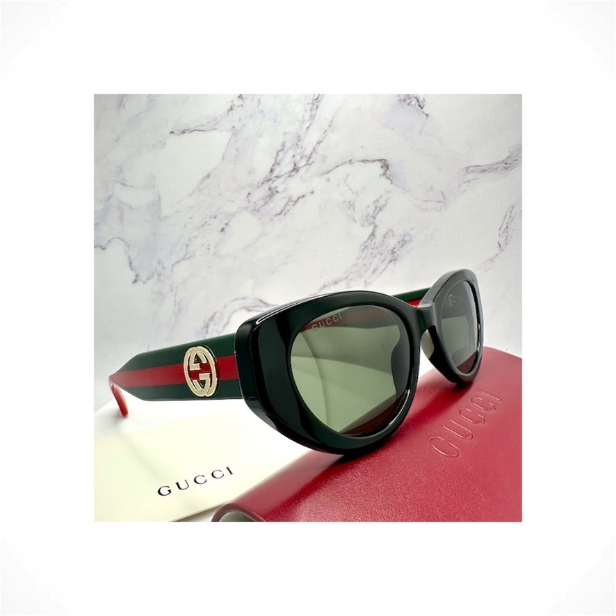 Gucci GG1862S 001 women's black cat eye acetate sunglasses with red and green web