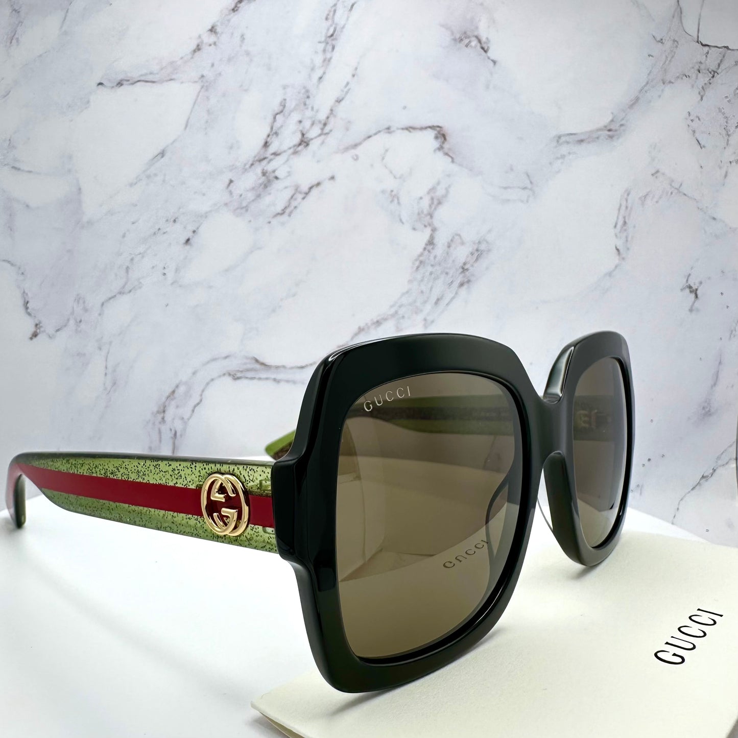 Gucci Sunglasses GG0036SN 002 black square oversized women’s frames with striped red green arms 