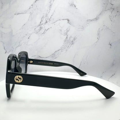 Gucci GG1337S 001 black sunglasses with interlocking gold GG logo.