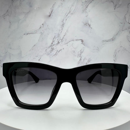 Gucci GG1714S 001 black square sunglasses with grey gradient lens and gold interlocking GG logo front view