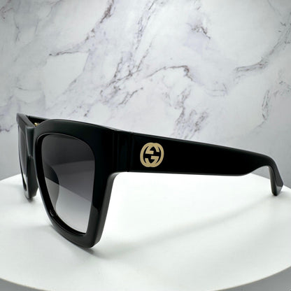 Gucci GG1714S 001 black square sunglasses side view with gold interlocking GG logo.