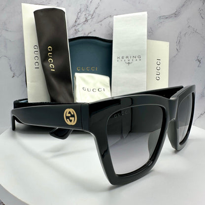 Gucci GG1714S 001 black square sunglasses with gold interlocking GG logo side view with authentic packaging and case.