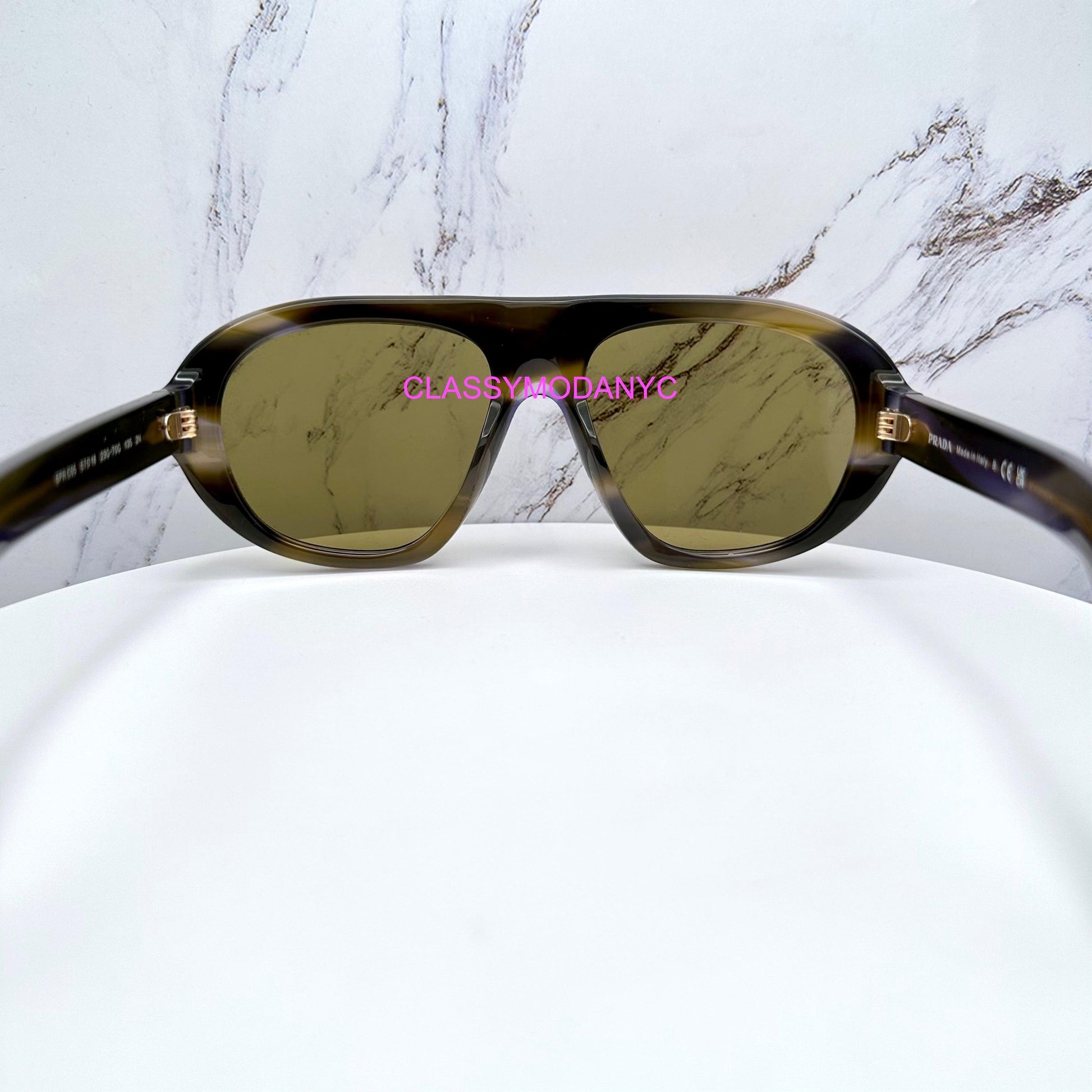 Prada PRC05S 23G70G aviator sunglasses with green lens