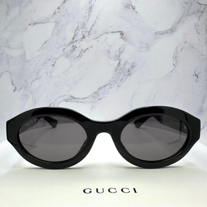 Gucci GG1579S 001 black oval front view