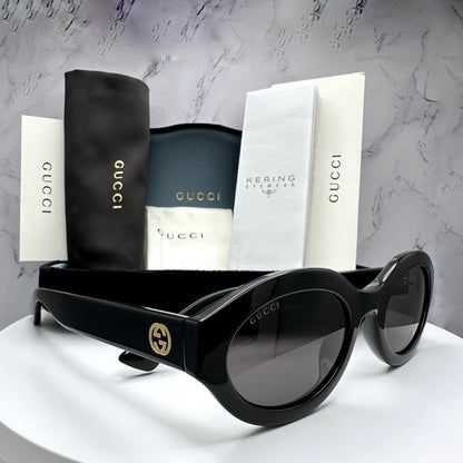 Gucci GG1579S 001 black oval GG logo sunglasses side vie